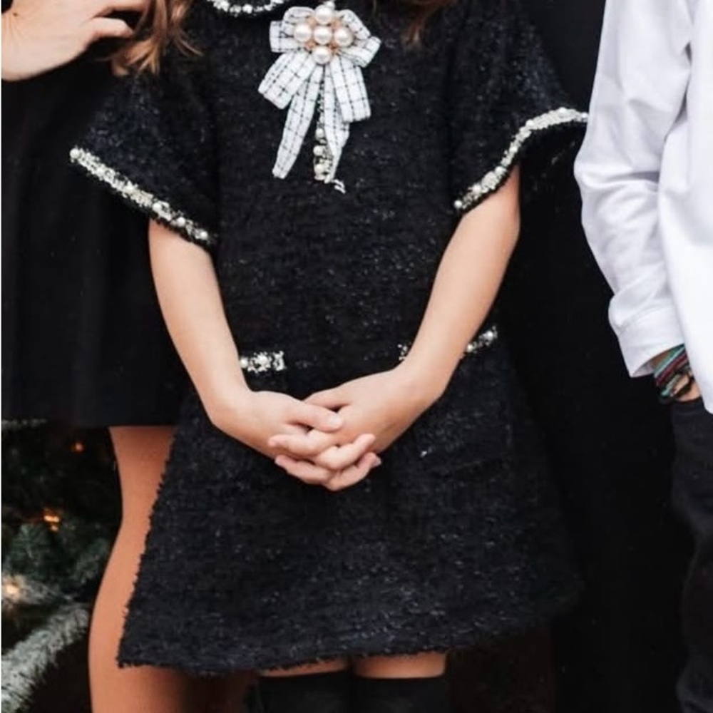 Elegant Black Tweed Dress with Pearl Brooch